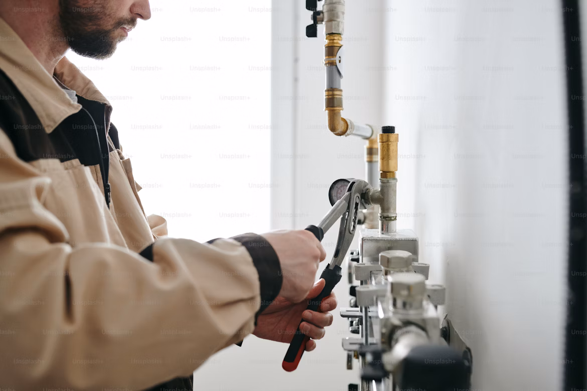 Technician working on modern plumbing and MEP systems