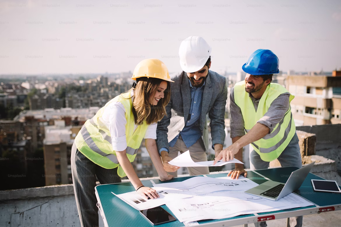 Architects and managers discussing a project on site